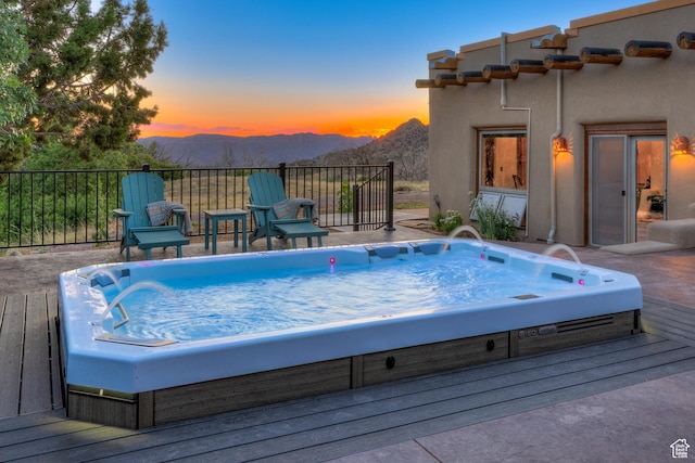 70 Desert Solitaire Rd, Moab, UT 84532 - pool at dusk featuring a mountain view