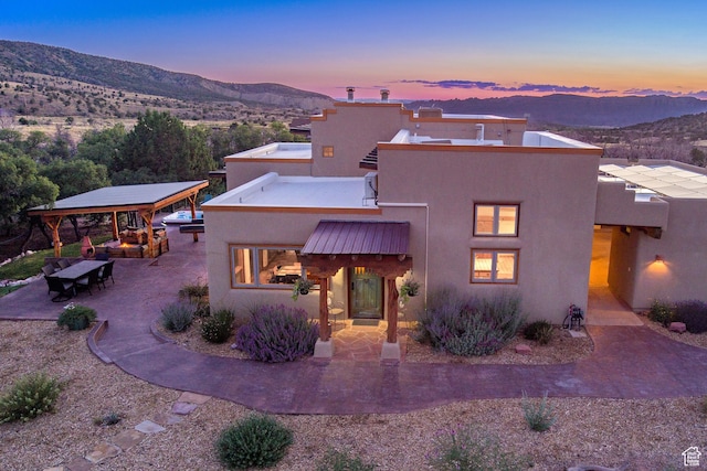 70 Desert Solitaire Rd, Moab, UT 84532 - mediterranean / spanish home featuring a mountain view, stucco siding, and a gazebo