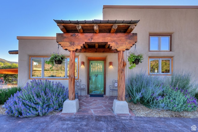 70 Desert Solitaire Rd, Moab, UT 84532 - doorway to property with stucco siding