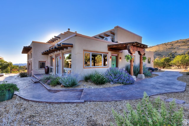 70 Desert Solitaire Rd, Moab, UT 84532 - view of home's exterior with a patio and stucco siding