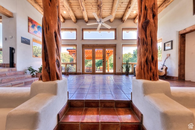 70 Desert Solitaire Rd, Moab, UT 84532 - living room with a wood ceiling with exposed beams, a ceiling fan, and a towering ceiling