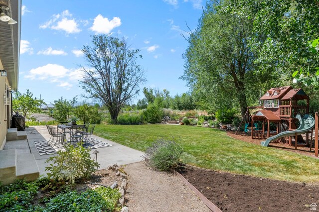 1066 W 575 N, Springville, UT 84663 - view of grassy yard featuring a patio and a playground