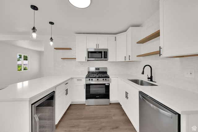 4243 W 5740 S, Salt Lake City, UT 84118 - kitchen featuring open shelves, appliances with stainless steel finishes, beverage cooler, and a peninsula