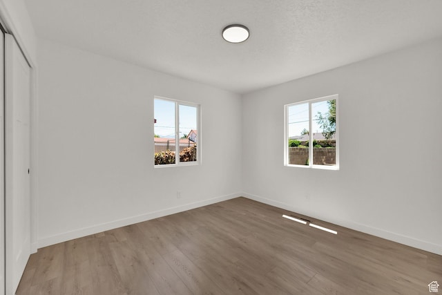 4243 W 5740 S, Salt Lake City, UT 84118 - unfurnished bedroom with wood finished floors and a closet
