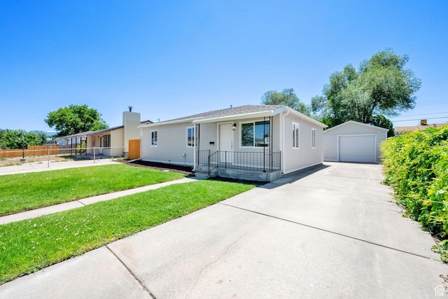 4243 W 5740 S, Salt Lake City, UT 84118 - view of front of house featuring an outbuilding, a garage, driveway, and covered porch