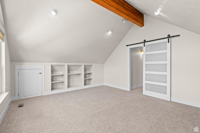 7861 N Tinamous Rd, Eagle Mountain, UT 84005 - bonus room featuring a barn door, a textured ceiling, carpet, and built in features