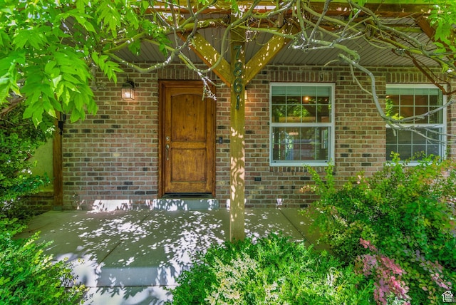 7861 N Tinamous Rd, Eagle Mountain, UT 84005 - doorway to property featuring brick siding