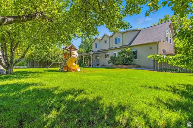 7861 N Tinamous Rd, Eagle Mountain, UT 84005 - view of yard with a playground