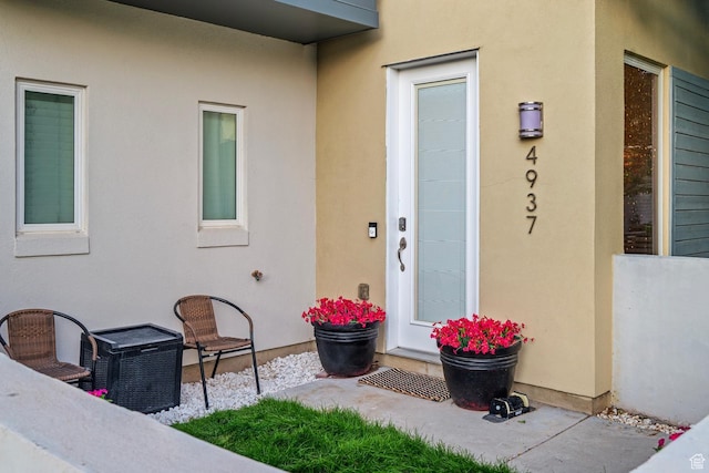 4937 W Daybreak Pkwy, South Jordan, UT 84009 - doorway to property featuring stucco siding