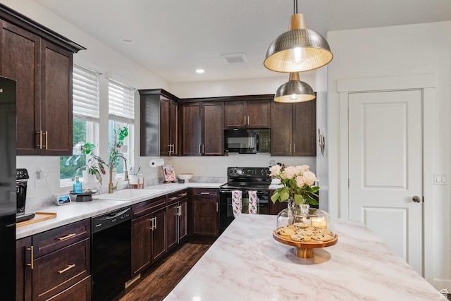 4937 W Daybreak Pkwy, South Jordan, UT 84009 - kitchen featuring black appliances, dark wood-style flooring, dark brown cabinetry, hanging light fixtures, and recessed lighting