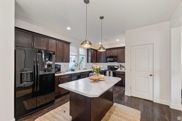 4937 W Daybreak Pkwy, South Jordan, UT 84009 - kitchen with black appliances, dark brown cabinets, light countertops, dark wood-style floors, and recessed lighting