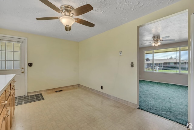 849 S 665 W, Woods Cross, UT 84087 - unfurnished room featuring a ceiling fan, a textured ceiling, light flooring, and light colored carpet