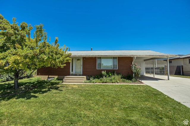 849 S 665 W, Woods Cross, UT 84087 - ranch-style home with an attached carport, driveway, and brick siding