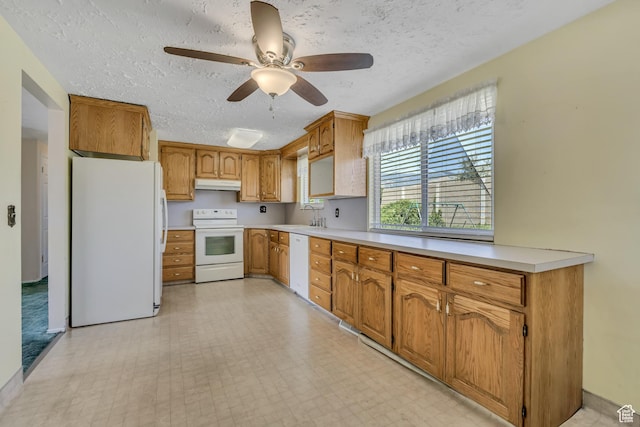 849 S 665 W, Woods Cross, UT 84087 - kitchen featuring white appliances, under cabinet range hood, light countertops, ceiling fan, and a textured ceiling