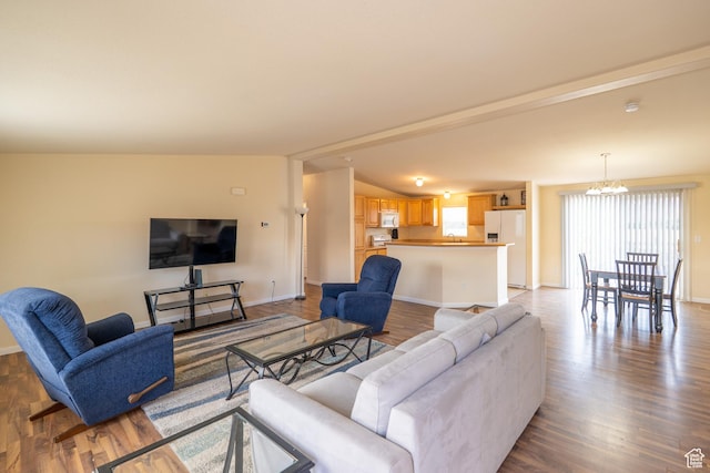 4568 Pueblo Verde Dr, Moab, UT 84532 - living room with wood finished floors and a chandelier