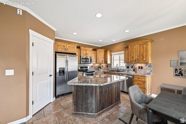 885 W 2150 N, Pleasant View, UT 84404 - kitchen featuring appliances with stainless steel finishes, tasteful backsplash, a center island, ornamental molding, and light stone countertops