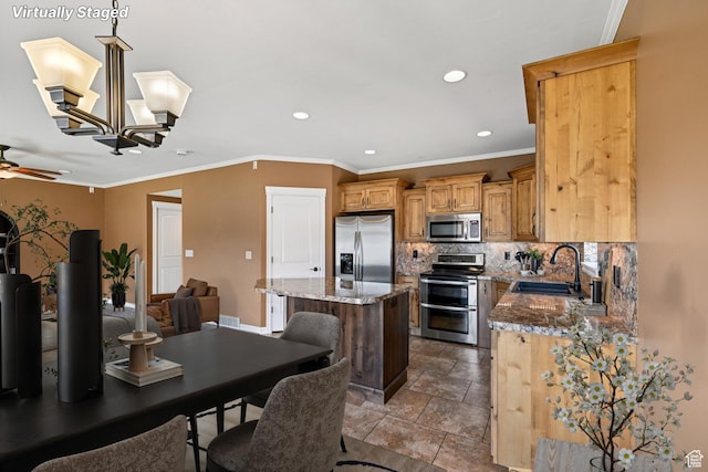 885 W 2150 N, Pleasant View, UT 84404 - kitchen featuring appliances with stainless steel finishes, a center island, tasteful backsplash, recessed lighting, and stone counters