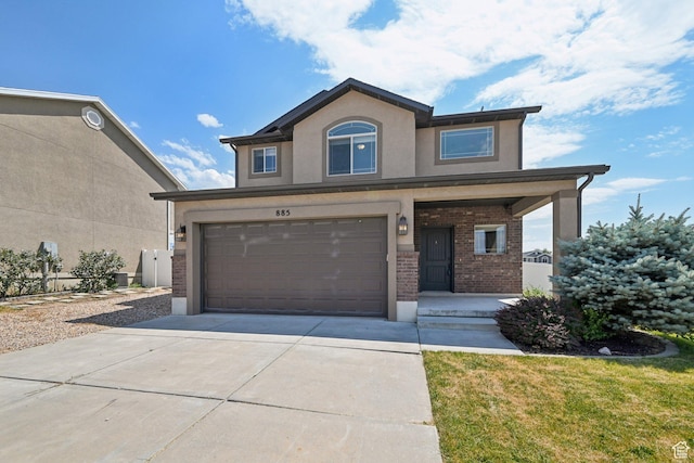 885 W 2150 N, Pleasant View, UT 84404 - traditional home featuring concrete driveway, brick siding, a garage, covered porch, and stucco siding