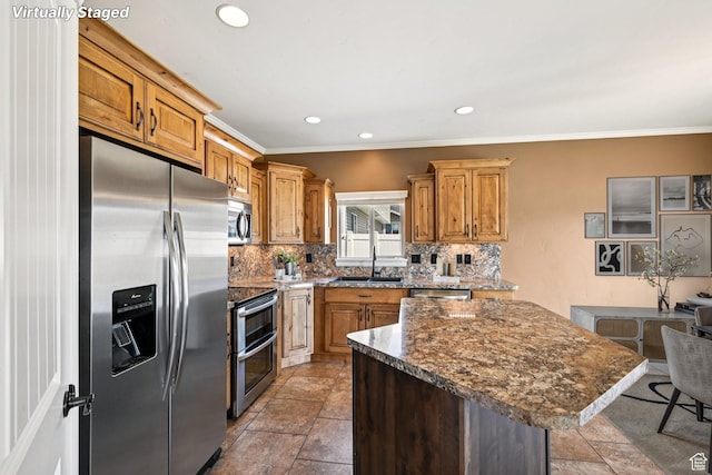885 W 2150 N, Pleasant View, UT 84404 - kitchen featuring appliances with stainless steel finishes, backsplash, a center island, ornamental molding, and recessed lighting