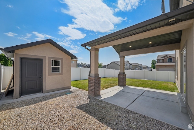 885 W 2150 N, Pleasant View, UT 84404 - fenced backyard featuring a patio and a storage shed