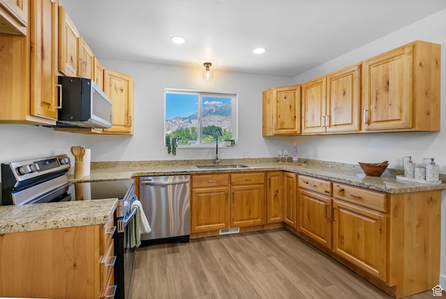 1455 N Amiron Way Unit D, Orem, UT 84057 - kitchen with appliances with stainless steel finishes, light wood-style floors, recessed lighting, and light stone counters