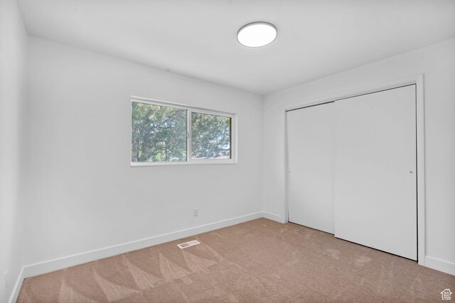 1455 N Amiron Way Unit D, Orem, UT 84057 - unfurnished bedroom featuring carpet floors and a closet