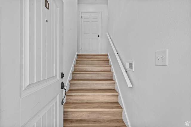 1455 N Amiron Way Unit D, Orem, UT 84057 - staircase featuring baseboards and wood finished floors