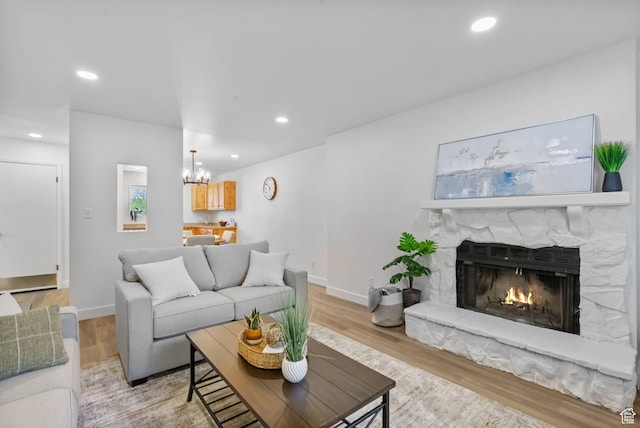 1455 N Amiron Way Unit D, Orem, UT 84057 - living area featuring a chandelier, light wood-type flooring, recessed lighting, and a stone fireplace