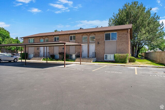 1455 N Amiron Way Unit D, Orem, UT 84057 - view of building exterior with covered and uncovered parking