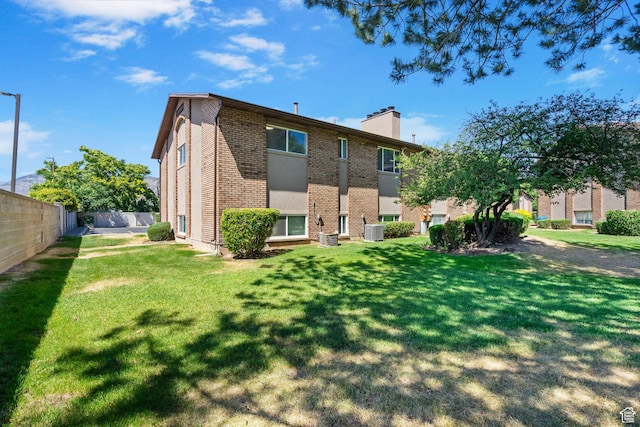 1455 N Amiron Way Unit D, Orem, UT 84057 - rear view of house with a chimney and brick siding
