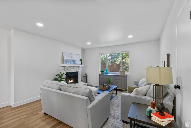 1455 N Amiron Way Unit D, Orem, UT 84057 - living area with a stone fireplace, light wood-style floors, and recessed lighting