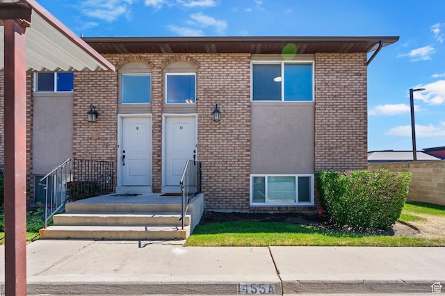 1455 N Amiron Way Unit D, Orem, UT 84057 - view of exterior entry featuring brick siding and stucco siding