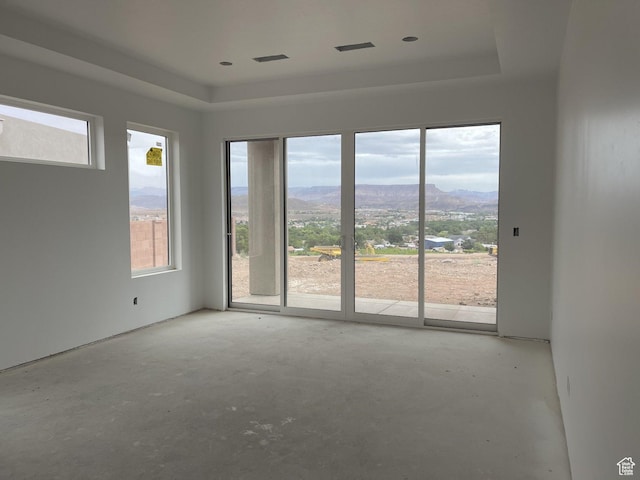 575 S 1800 W, Hurricane, UT 84737 - unfurnished room with a tray ceiling, a mountain view, and concrete flooring