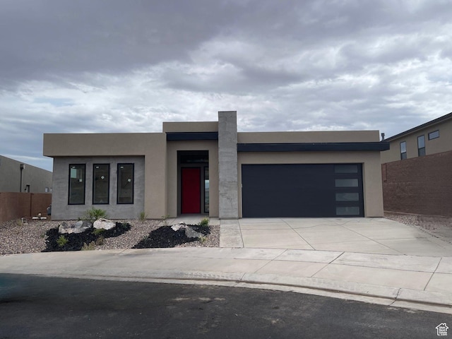 575 S 1800 W, Hurricane, UT 84737 - modern home with an attached garage, concrete driveway, and stucco siding