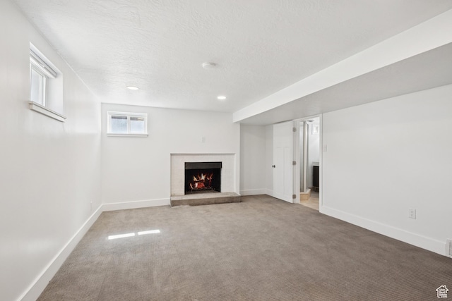 223 E 100 N, Bountiful, UT 84010 - unfurnished living room featuring a fireplace, carpet flooring, a textured ceiling, and recessed lighting