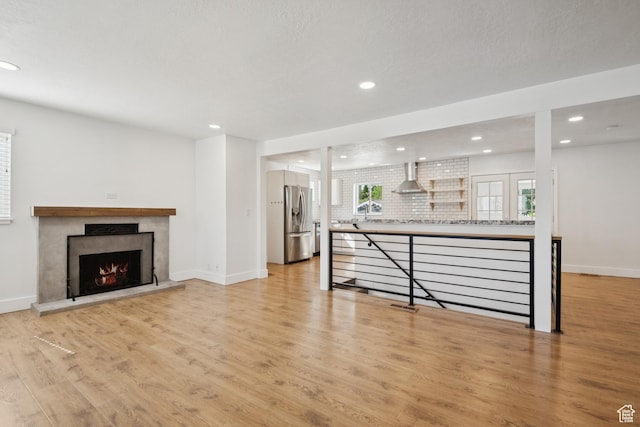 223 E 100 N, Bountiful, UT 84010 - living room with light wood-style floors, recessed lighting, and a premium fireplace