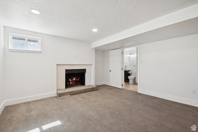 223 E 100 N, Bountiful, UT 84010 - unfurnished living room featuring carpet floors, a brick fireplace, recessed lighting, and a textured ceiling