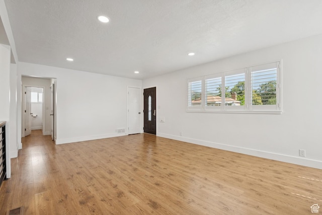 223 E 100 N, Bountiful, UT 84010 - spare room featuring healthy amount of natural light, light wood-style flooring, and recessed lighting