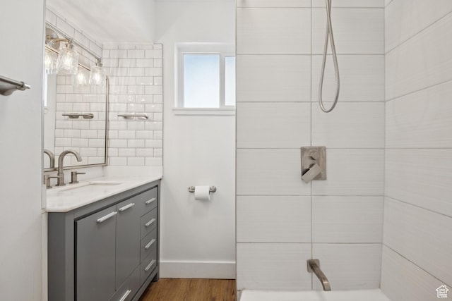 223 E 100 N, Bountiful, UT 84010 - full bathroom with vanity, a tile shower, and wood finished floors