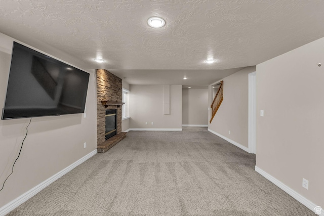 1082 E 370 N, American Fork, UT 84003 - unfurnished living room featuring carpet floors, a textured ceiling, stairs, and a stone fireplace