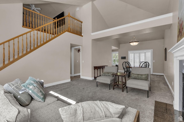 1082 E 370 N, American Fork, UT 84003 - carpeted living area with stairway, a fireplace, and a towering ceiling