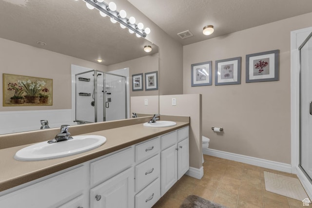 1082 E 370 N, American Fork, UT 84003 - full bathroom featuring a stall shower, a textured ceiling, double vanity, and tile patterned flooring