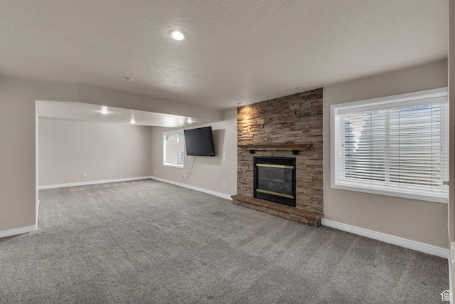 1082 E 370 N, American Fork, UT 84003 - unfurnished living room featuring carpet, a fireplace, and a textured ceiling