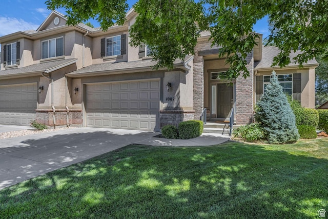 1082 E 370 N, American Fork, UT 84003 - townhome / multi-family property featuring stucco siding, driveway, a garage, and a front yard