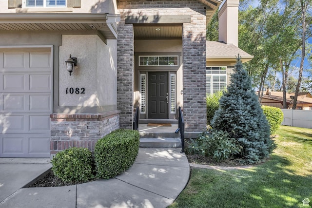 1082 E 370 N, American Fork, UT 84003 - view of exterior entry featuring stucco siding, stone siding, and an attached garage