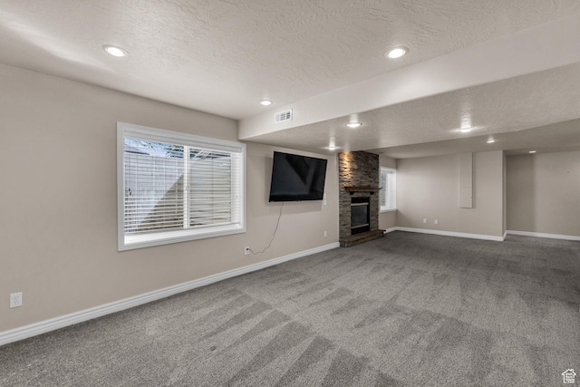 1082 E 370 N, American Fork, UT 84003 - unfurnished living room featuring a textured ceiling, carpet flooring, a large fireplace, and recessed lighting