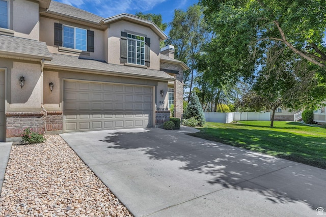 1082 E 370 N, American Fork, UT 84003 - view of front of home featuring stucco siding, concrete driveway, an attached garage, brick siding, and a chimney
