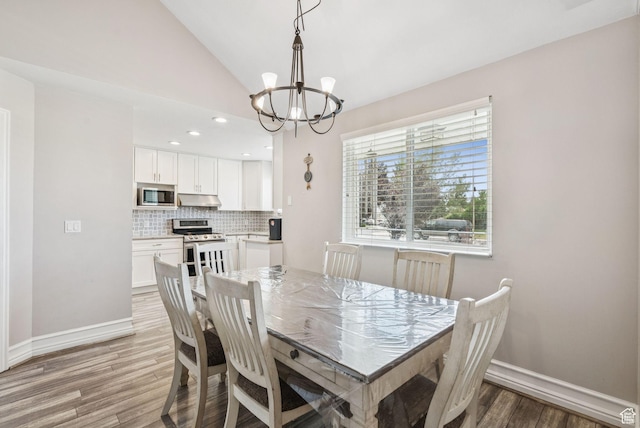 9355 S Peruvian Dr E, Sandy, UT 84093 - dining space featuring a chandelier, light wood finished floors, lofted ceiling, and recessed lighting