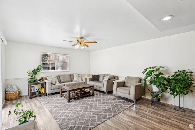 9355 S Peruvian Dr E, Sandy, UT 84093 - living area with wood finished floors and a ceiling fan