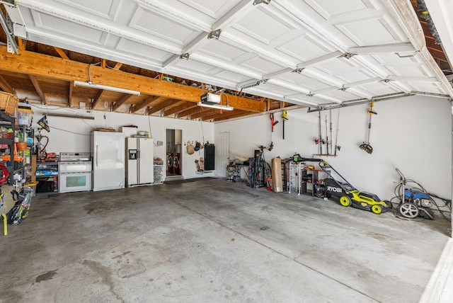 9355 S Peruvian Dr E, Sandy, UT 84093 - garage featuring a garage door opener, freestanding refrigerator, and white refrigerator with ice dispenser